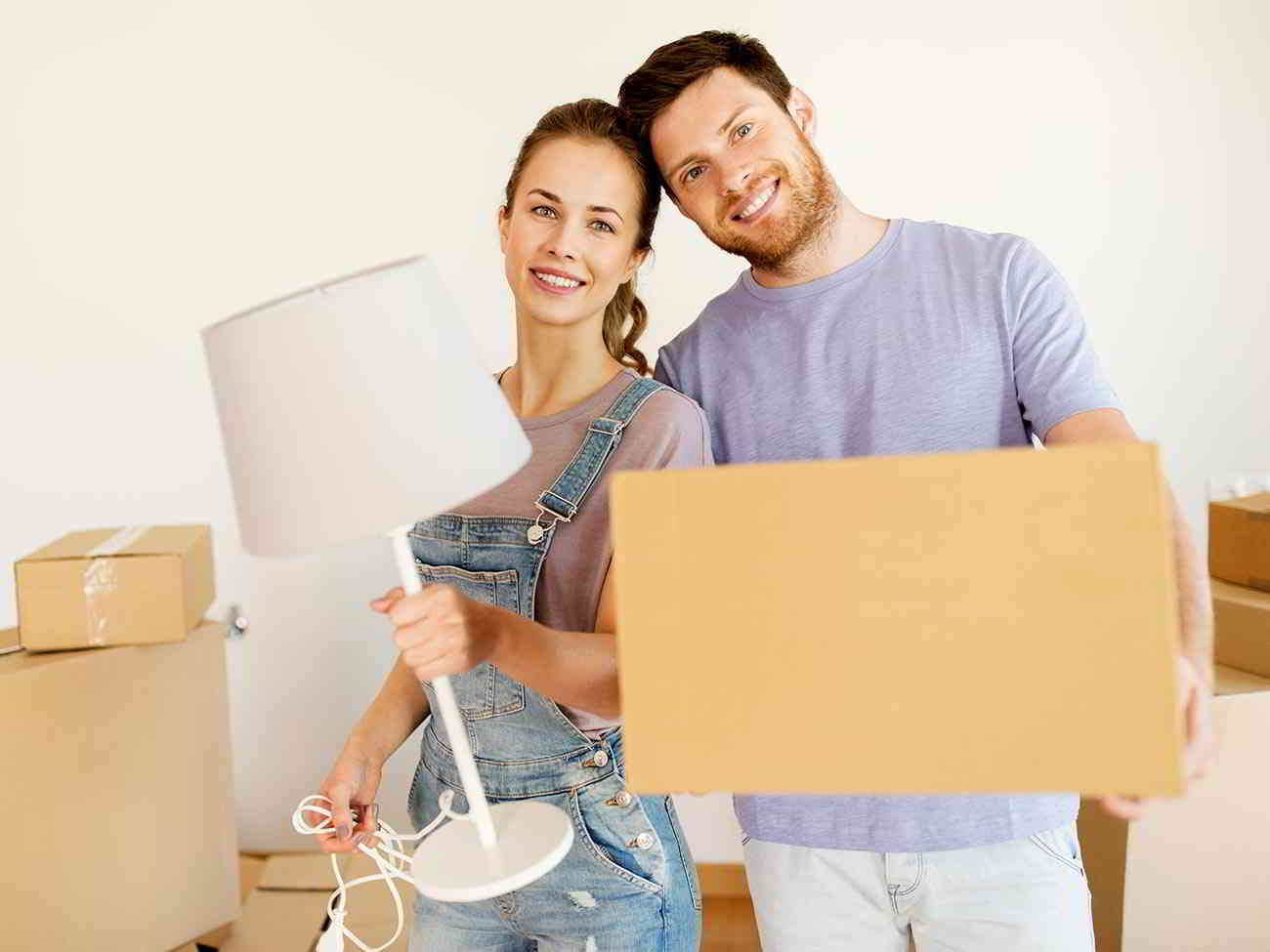 couple packing moving boxes