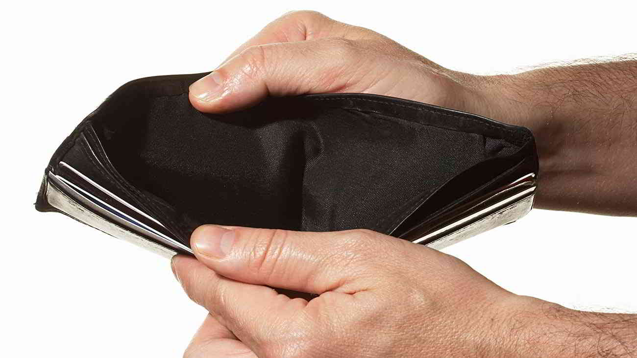 man holding empty wallet