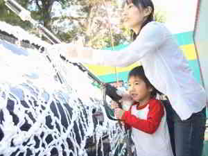 family washing car