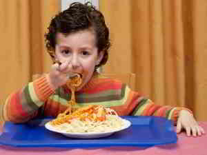 kid eating spaghetti
