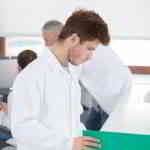 young doctor studying chart