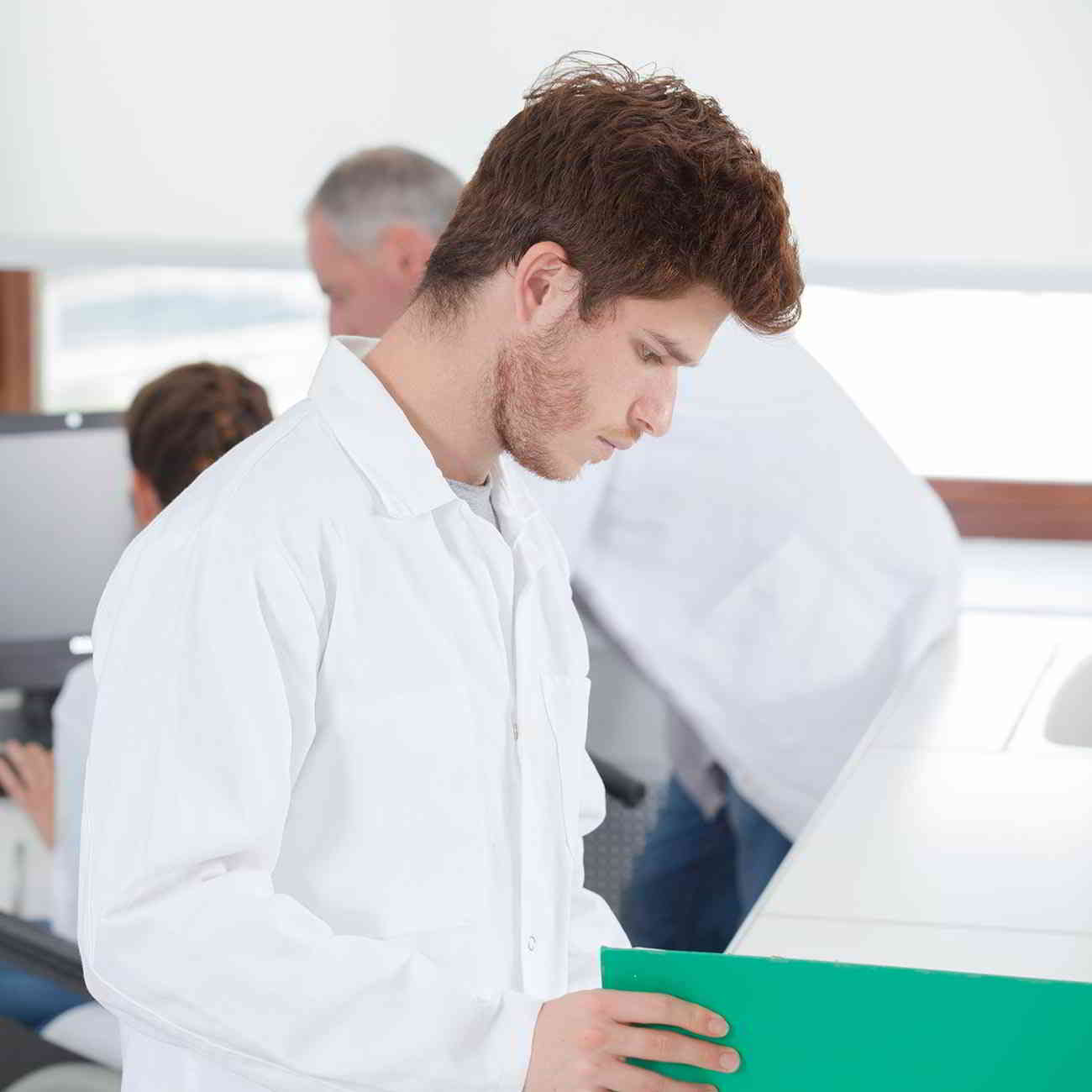 young doctor studying chart