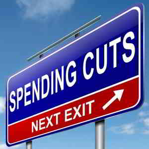 spending cuts next exit road sign
