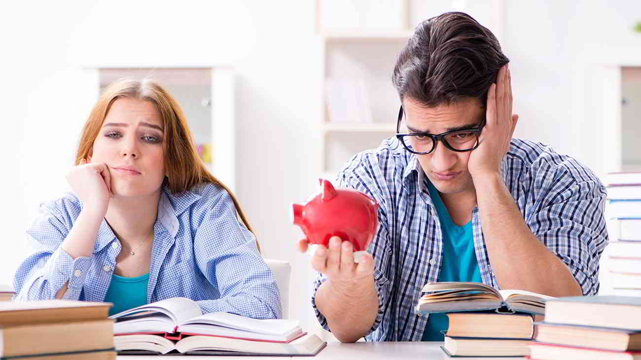 unhappy couple with empty piggy bank