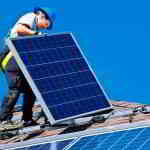 man installing solar panels