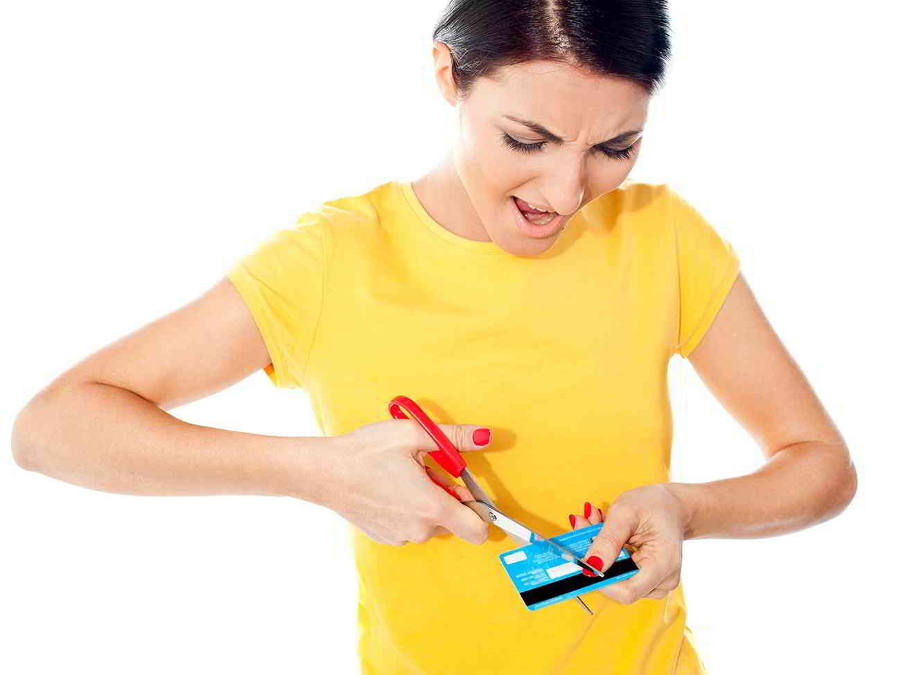 woman cutting up credit card