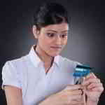 woman destroying credit card