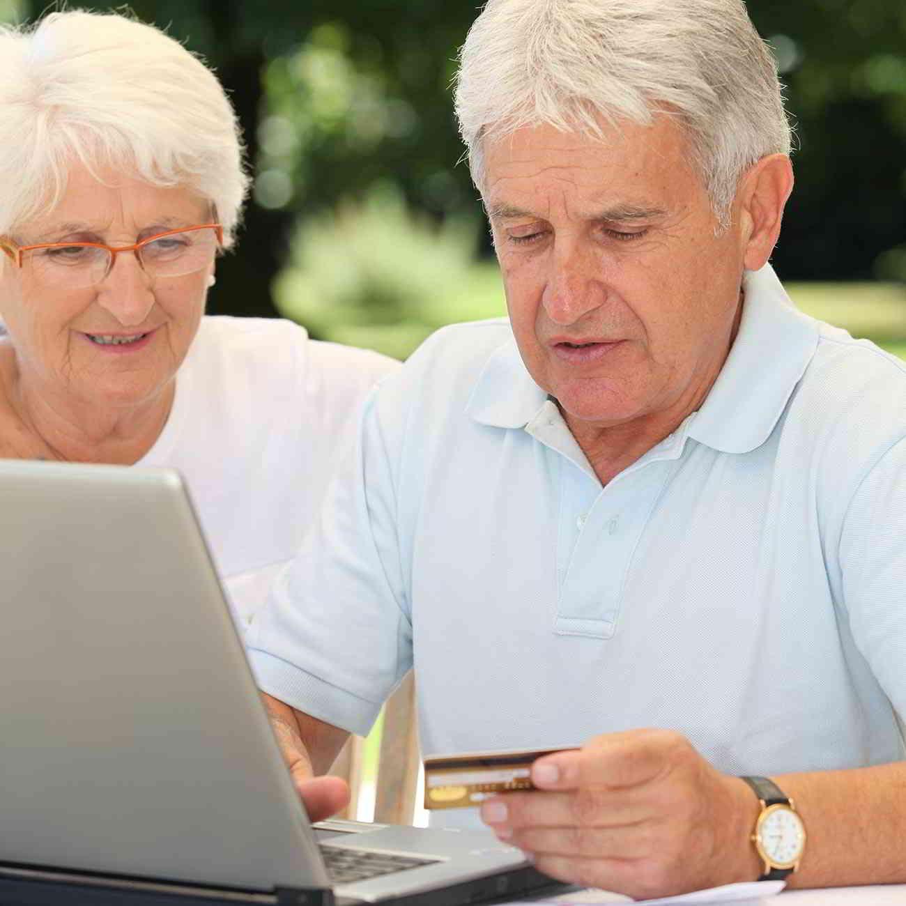 couple paying bill with credit card