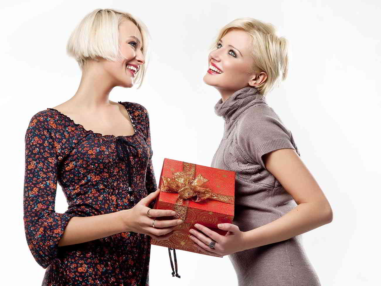 woman giving gift to friend
