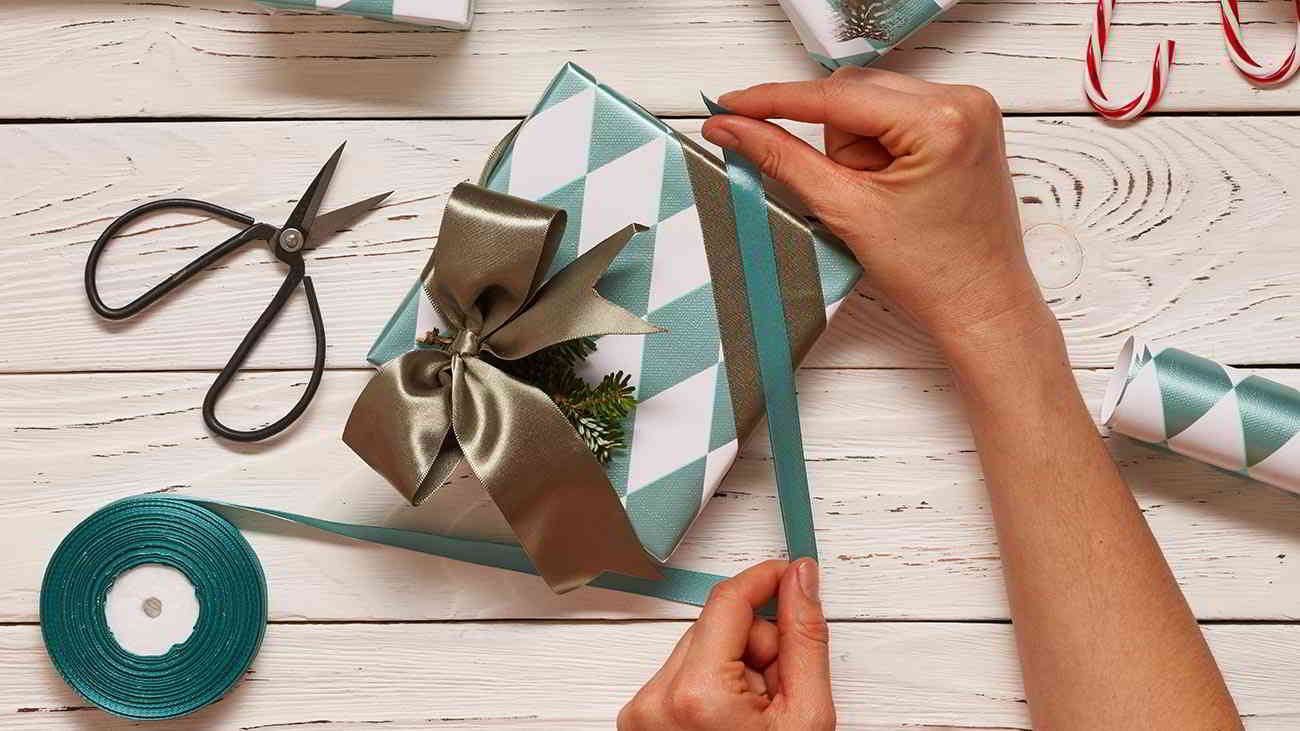 woman wrapping gift