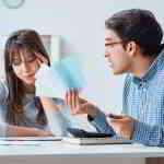 couple looking at credit card bills