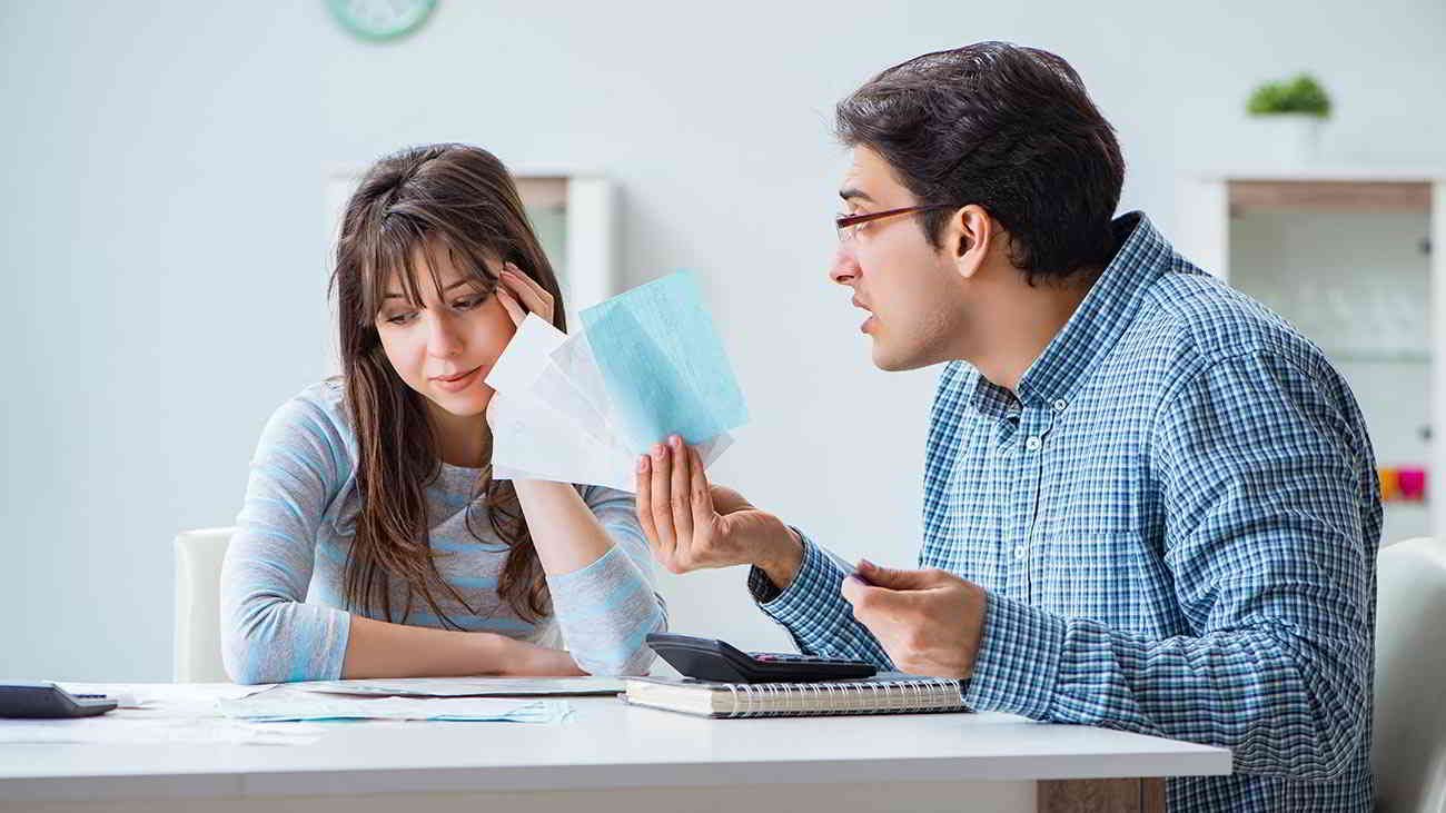 couple looking at credit card bills