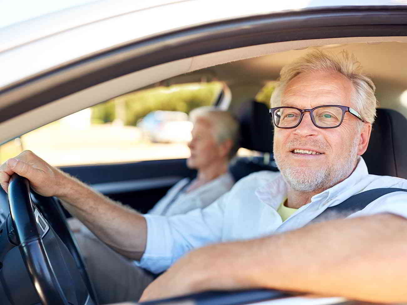 elderly couple in car
