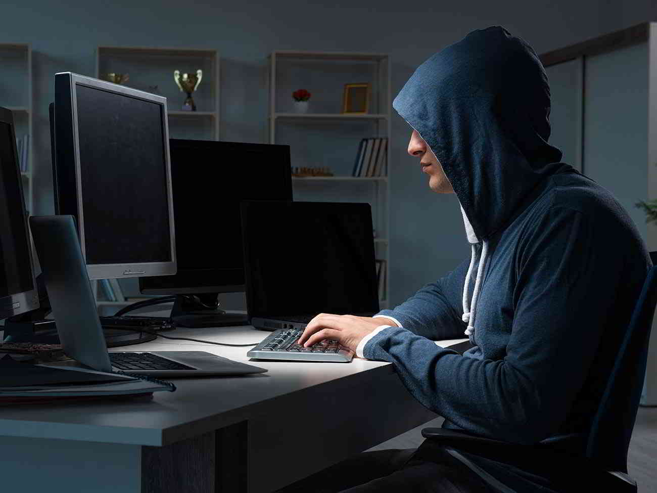 man committing online fraud