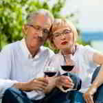 retired couple enjoying wine