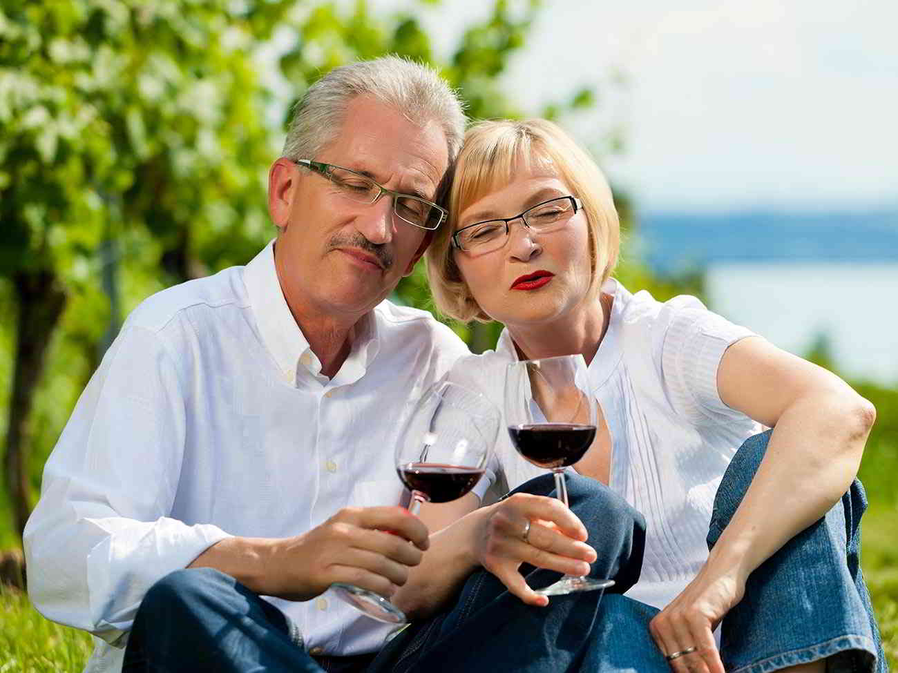 retired couple enjoying wine