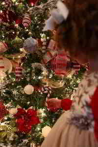 little girl in front of elegant Christmas tree