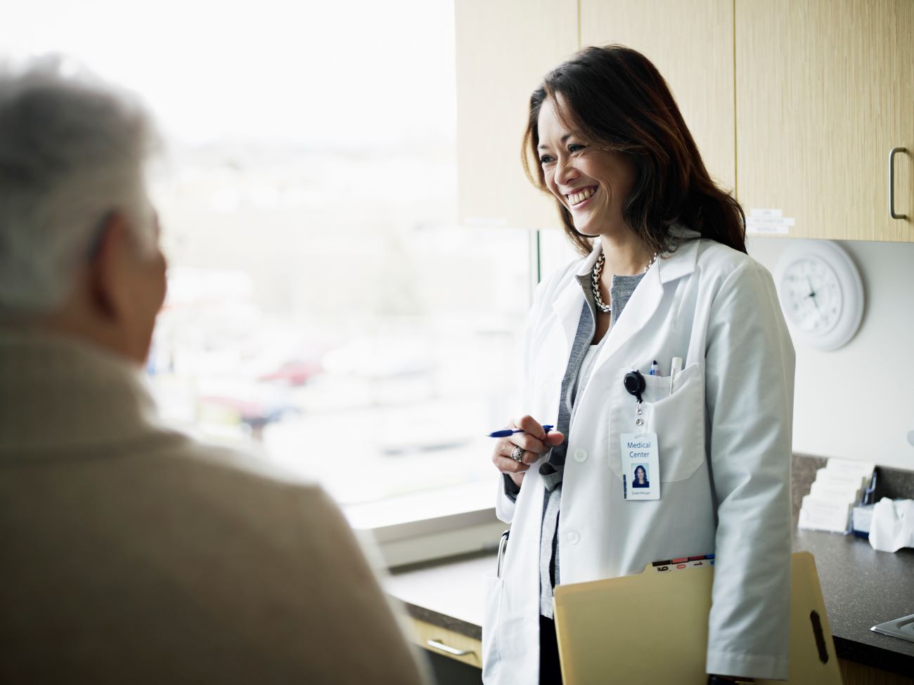 A doctor and patient discuss treatments