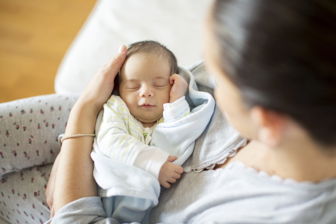 A mother hold her newborn baby