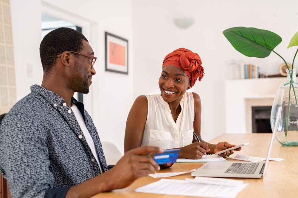 A couple works on their personal finances to pay down debt and consolidate loans