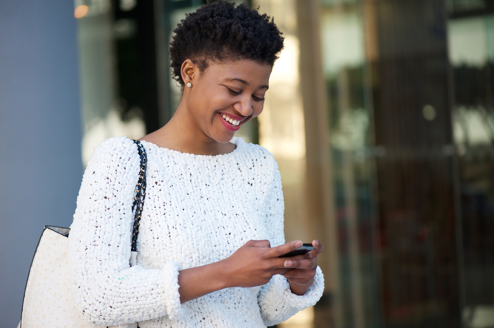 A women uses a banking app to pay her personal loan with her smart phone
