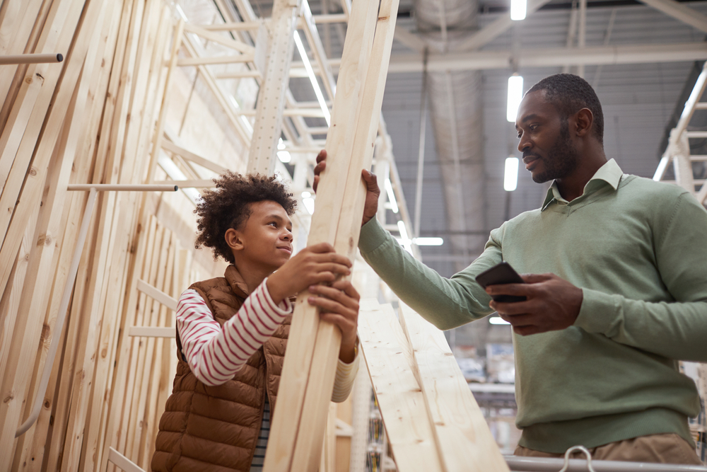 A man and his son visit the home improvement store to purchase items paid for with a home improvement personal loan