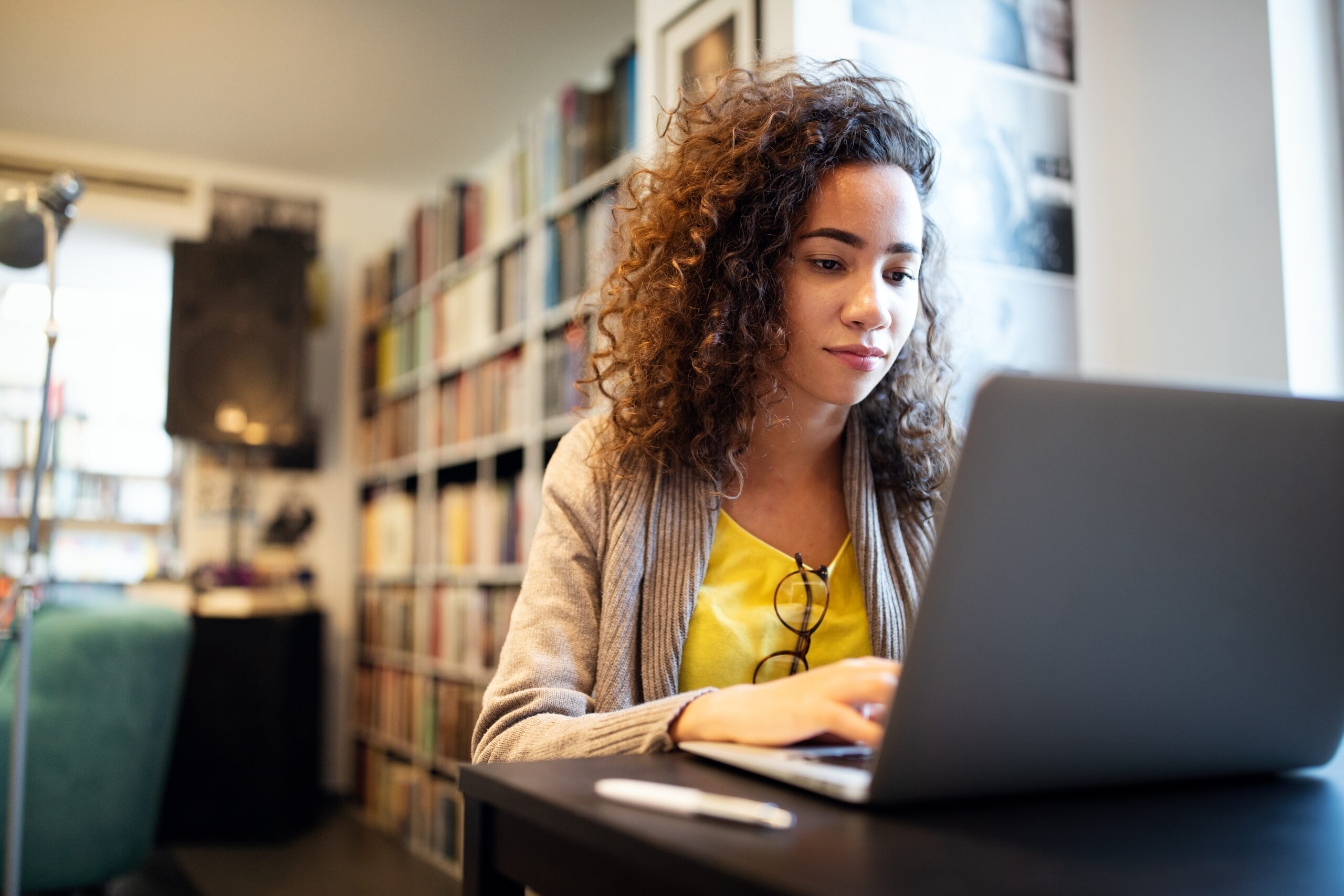 young student girl learning in college library